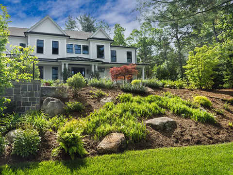 Freshly mulched and weeded front flower beds on a Spring day